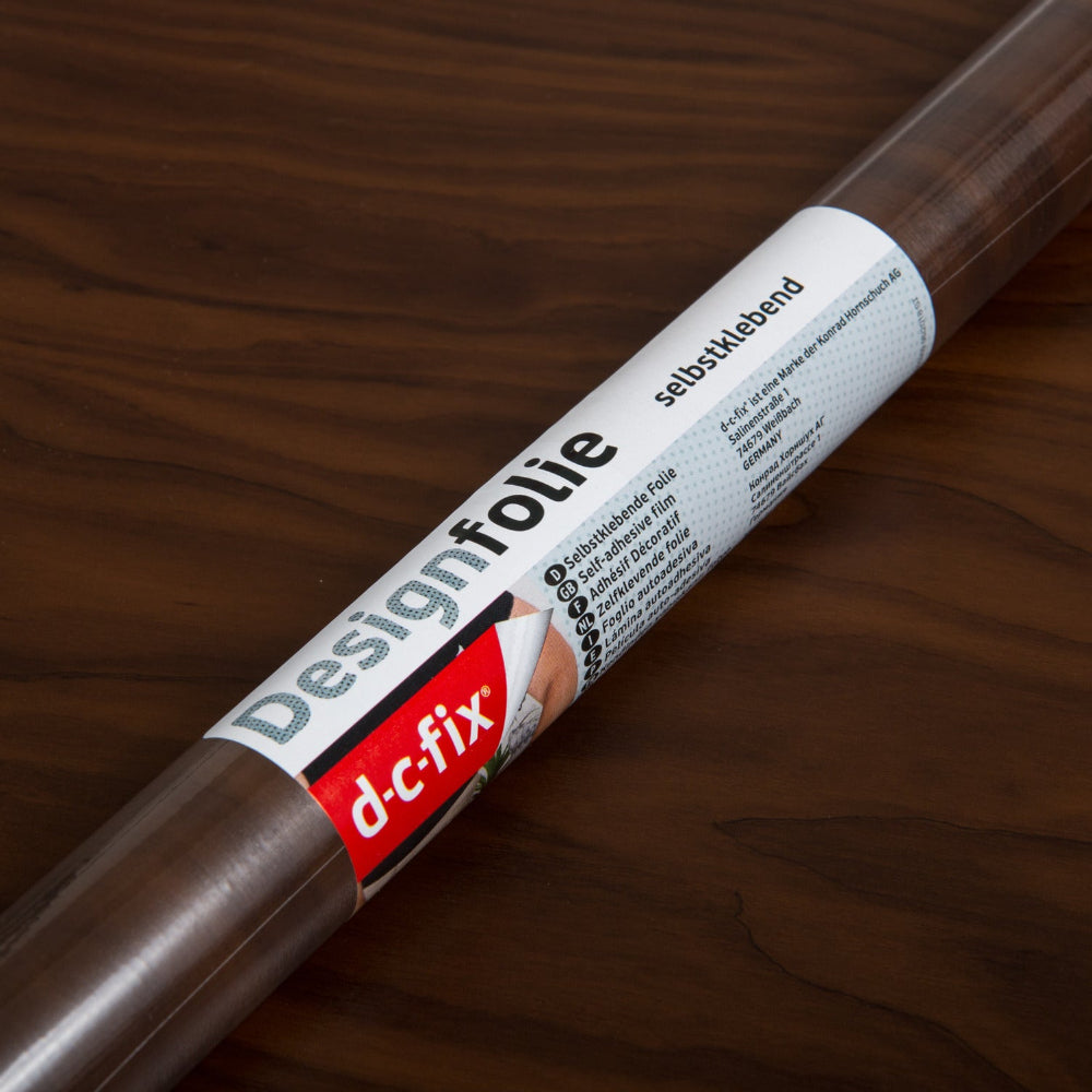 Roll of d-c-fix designfolie on a wooden surface
