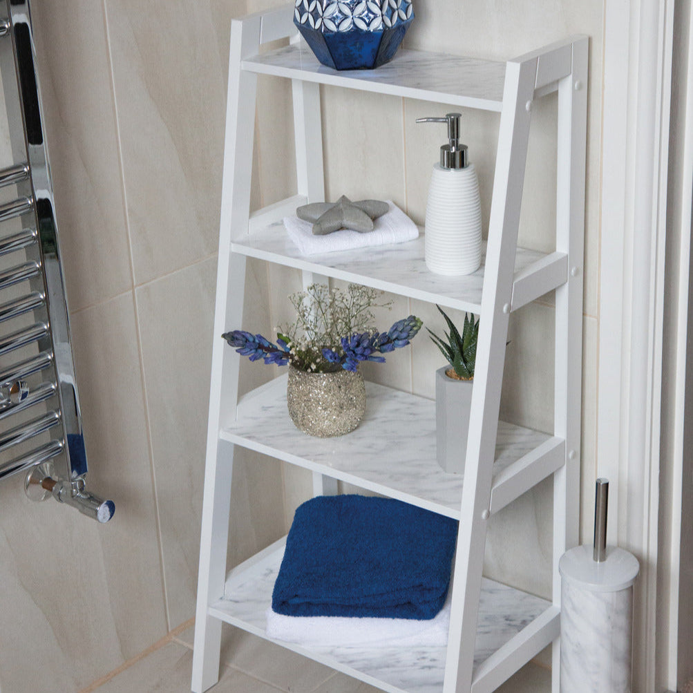 White ladder shelf with decorative items in a bathroom setting