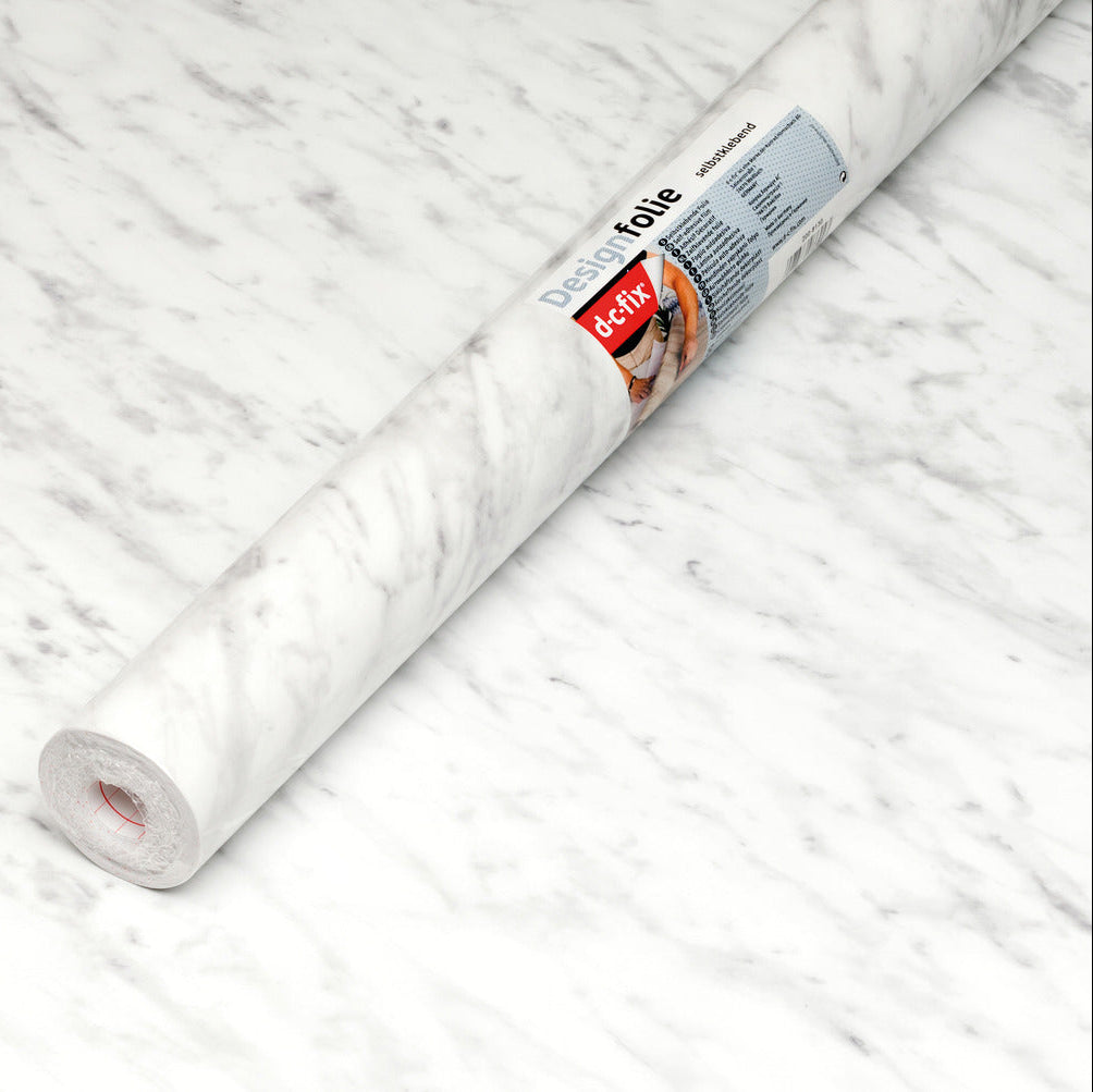 Roll of marble vinyl with a brand label on a marble surface