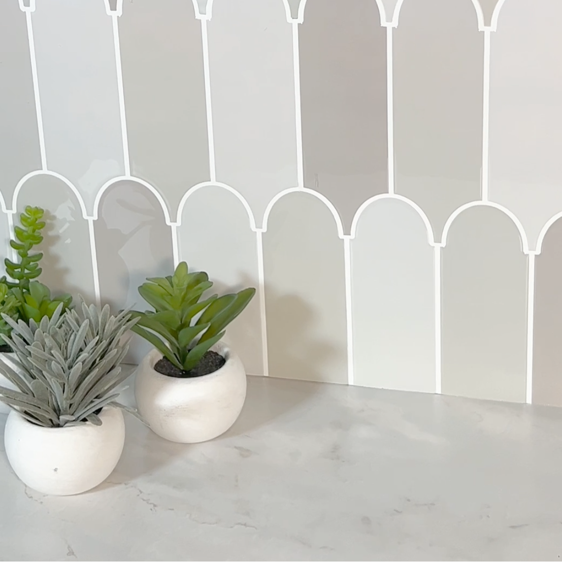 feather grey vinyl wall tiles splashback and flower pots