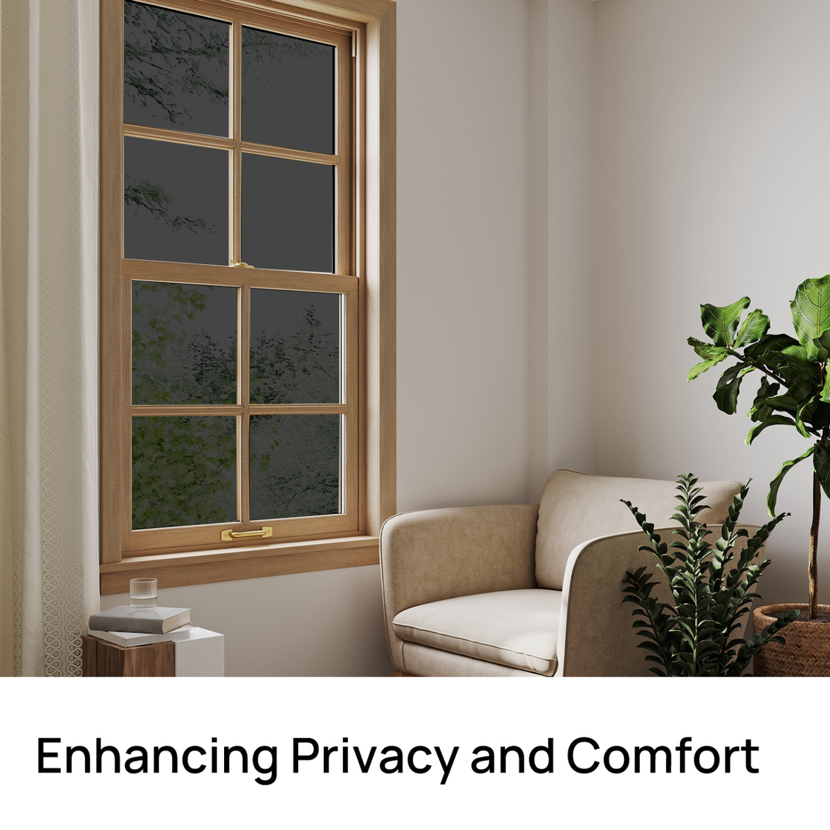 Window with privacy film, beige armchair, and plants in a room setting.