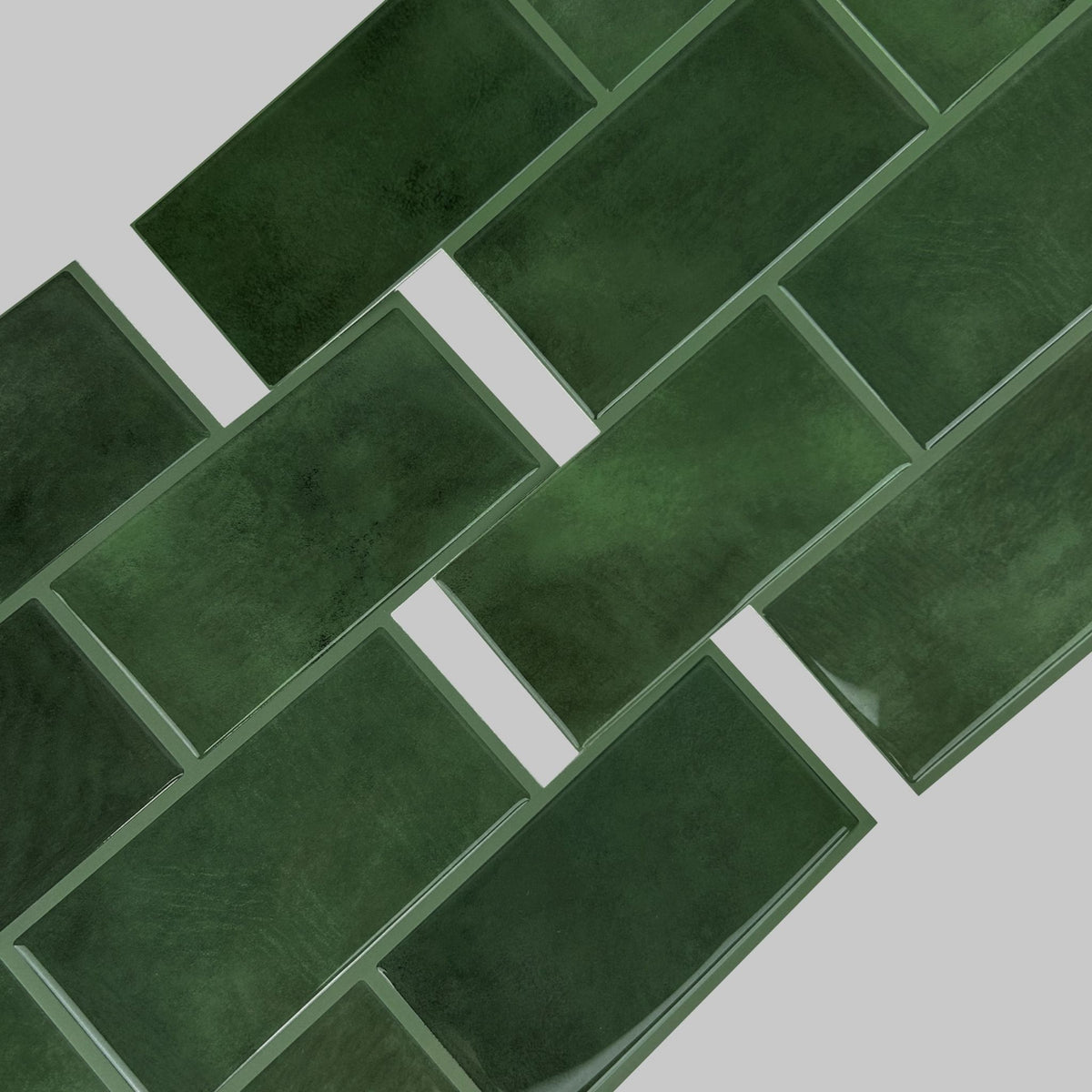 Dark green subway tile sheets on a light grey background.