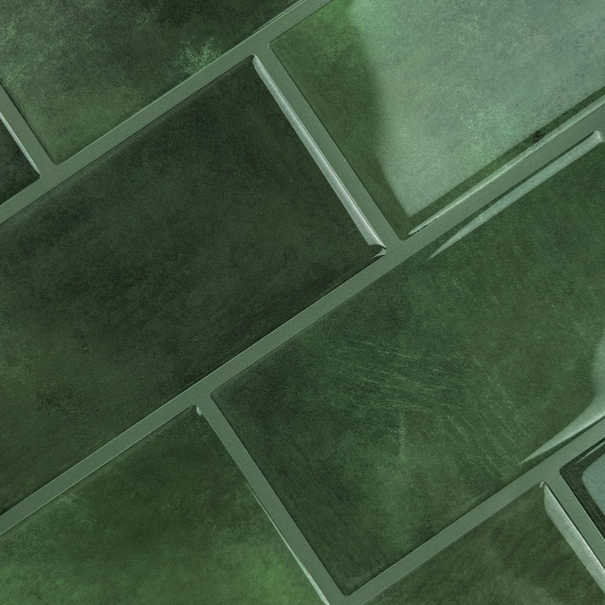 Dark green rectangular glossy tiles with green grout lines.