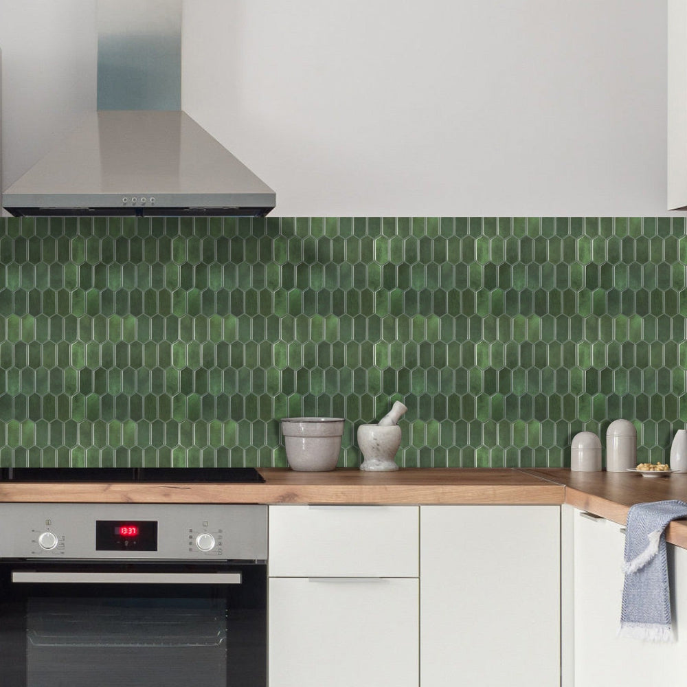 Kitchen with green hexagonal tile backsplash and wooden countertop.