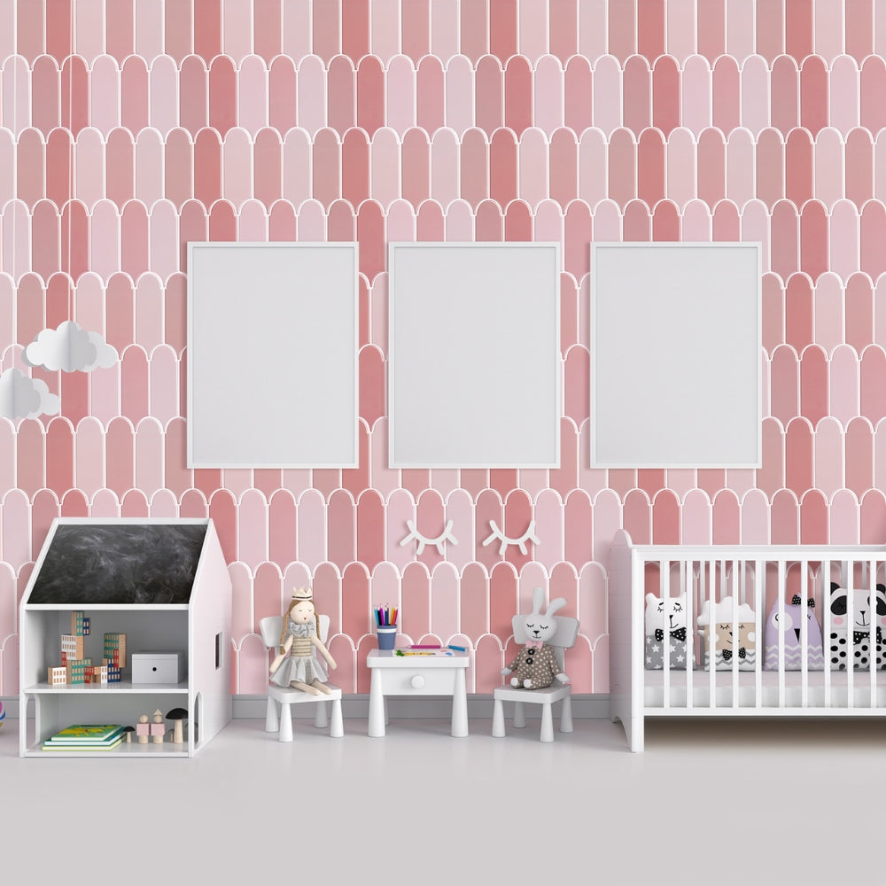 Children&#39;s room with pink geometric tiles, white furniture, and toys.