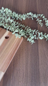 Close up video of oak flat grain dark architectural grade adhesive vinyl