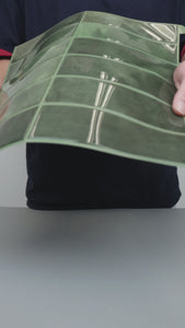 green stacked subway tiles installation
