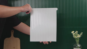 Installation video of reeded white tiles