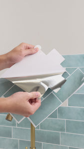 installation of min peel and stick subway tiles