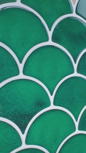 Scalloped green tiles close up