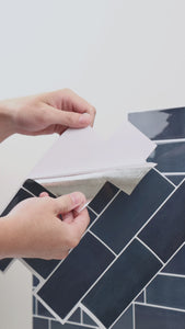 Installation of blue subway peel and stick tiles
