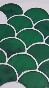 Scalloped green tiles installation